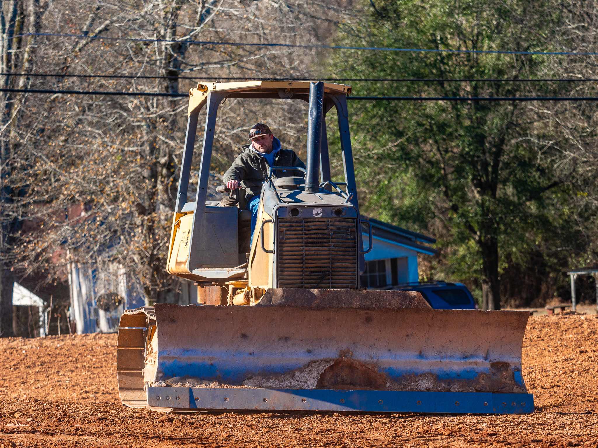 Crawler dozer cutting and filling a site during excavation and grading work in Alabama