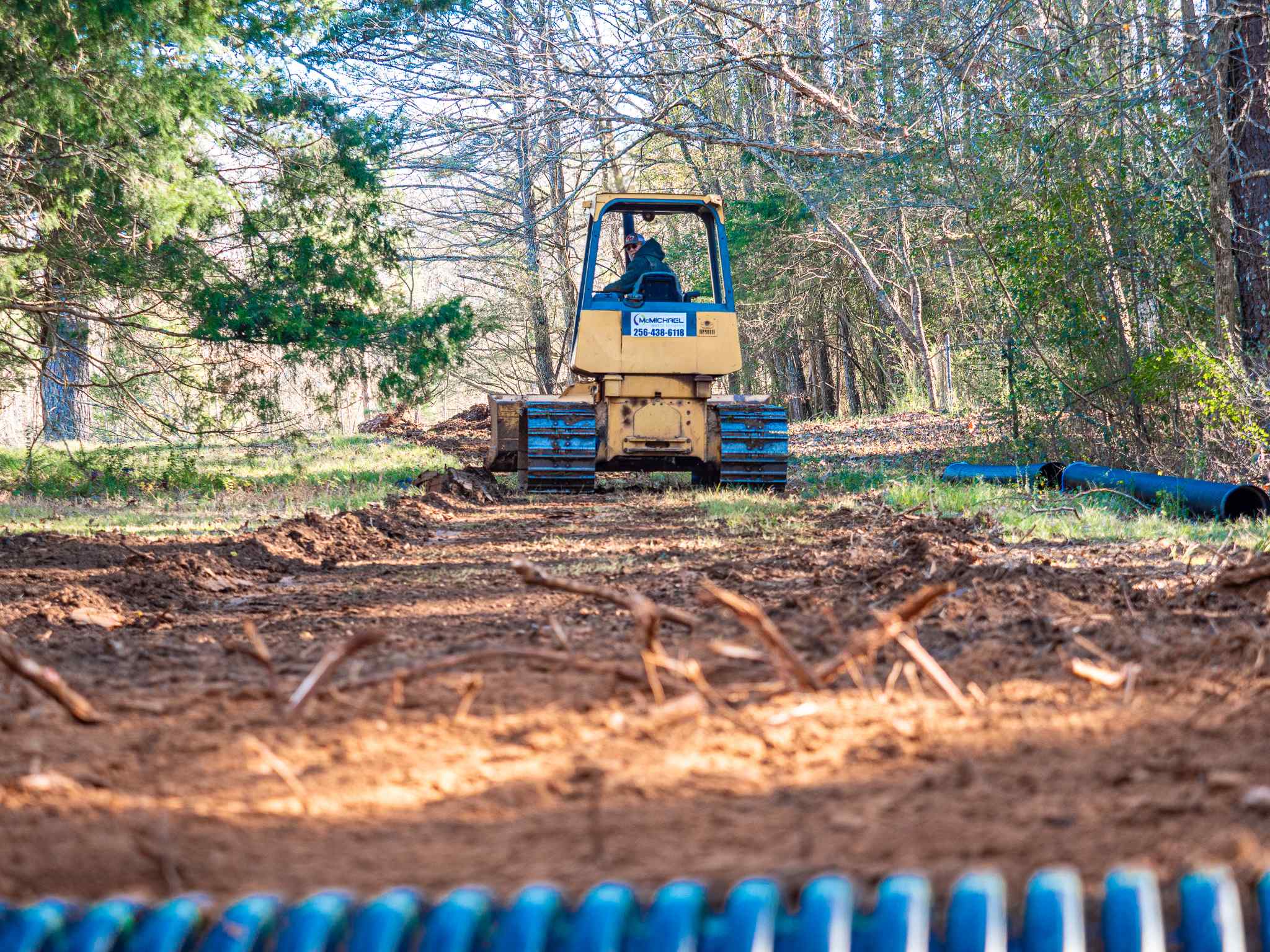 Dozer clearing trees, brush and stumps on raw land in Alabama
