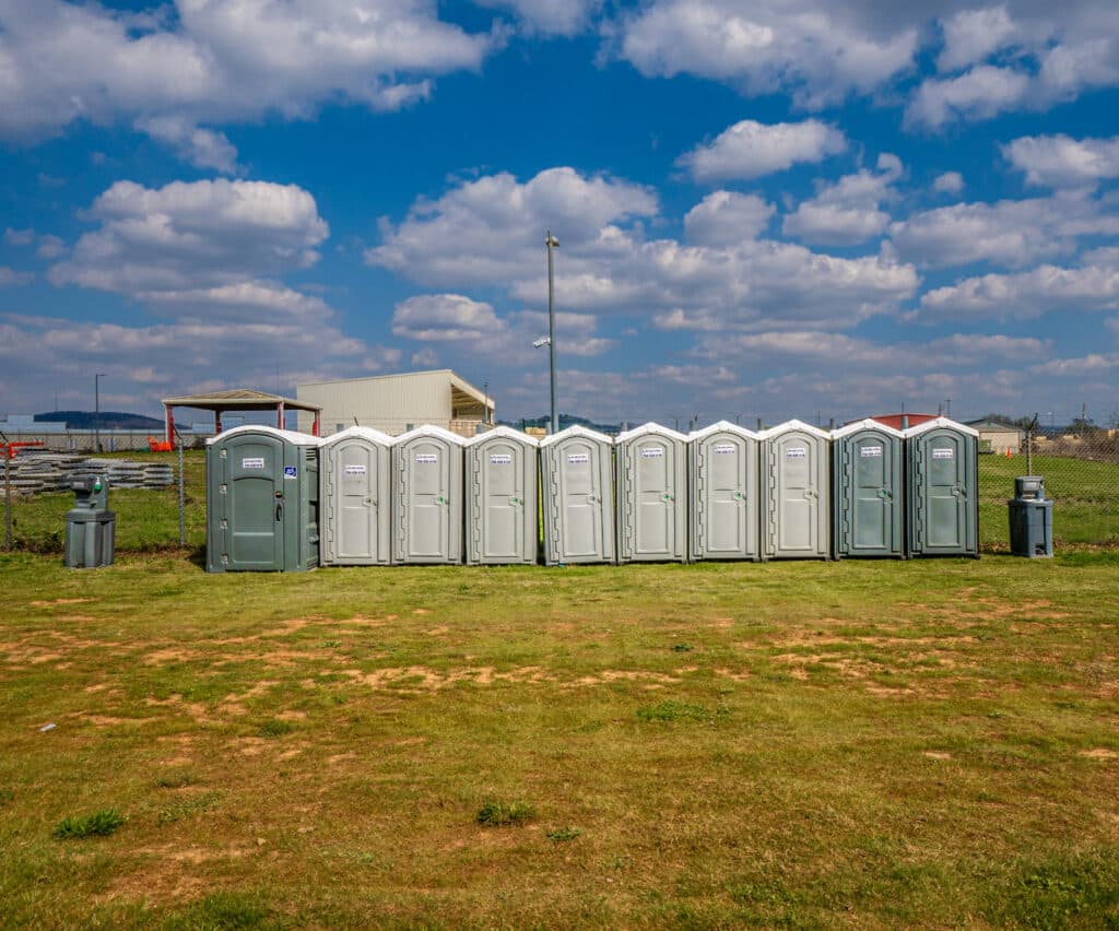 McMichael Waste Services standard and ADA portable toilets on the field at an outdoor event in Huntsville, Alabama