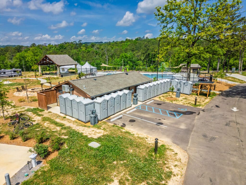 Aerial of a McMichael Waste Services portable toilet bank at an event in Alabama