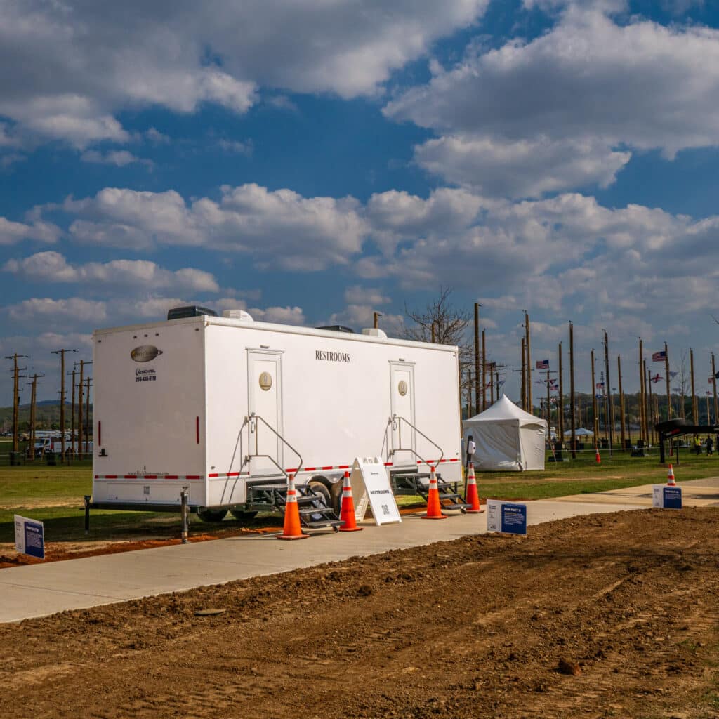 McMichael Waste Services luxury restroom trailer at an outdoor event in Huntsville, Alabama