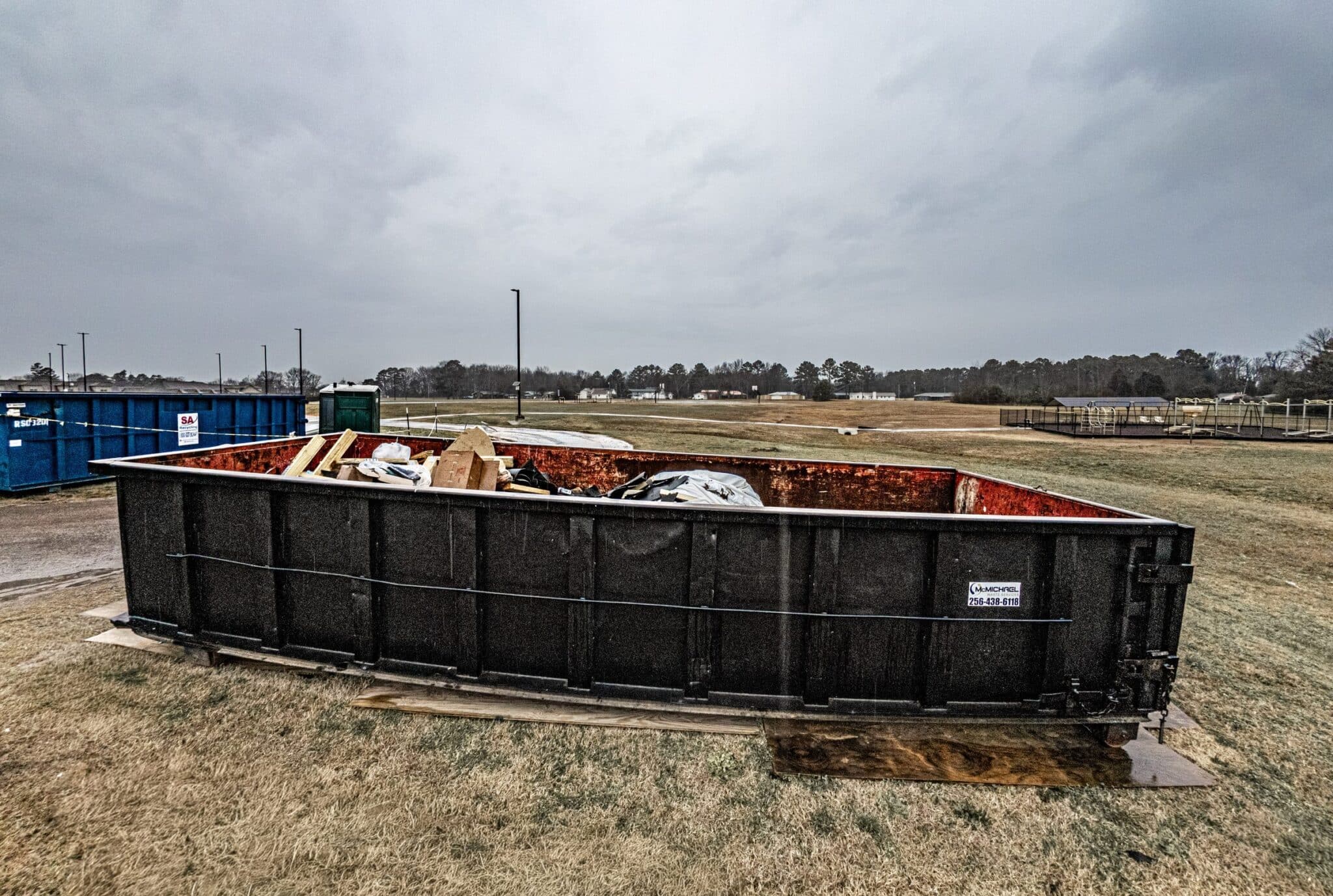 McMichael Waste Services roll-off dumpster placed on a jobsite in Alabama