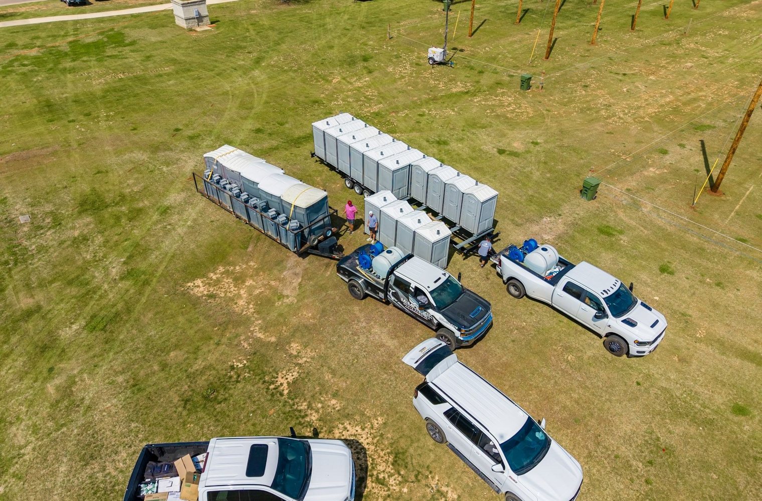 Aerial of McMichael Waste Services trucks staging restroom trailers and portable toilets in Huntsville, Alabama