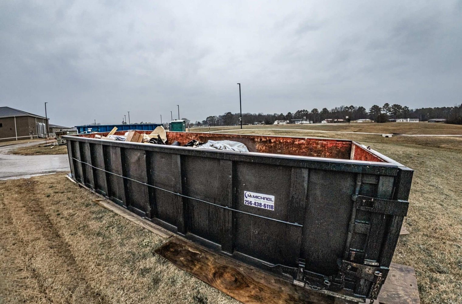McMichael Waste Services roll-off container placed on a jobsite