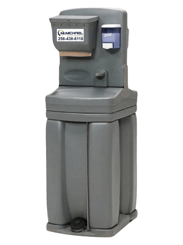 Freestanding McMichael Waste Services portable hand-washing station with foot-pump basin, soap and paper-towel dispensers