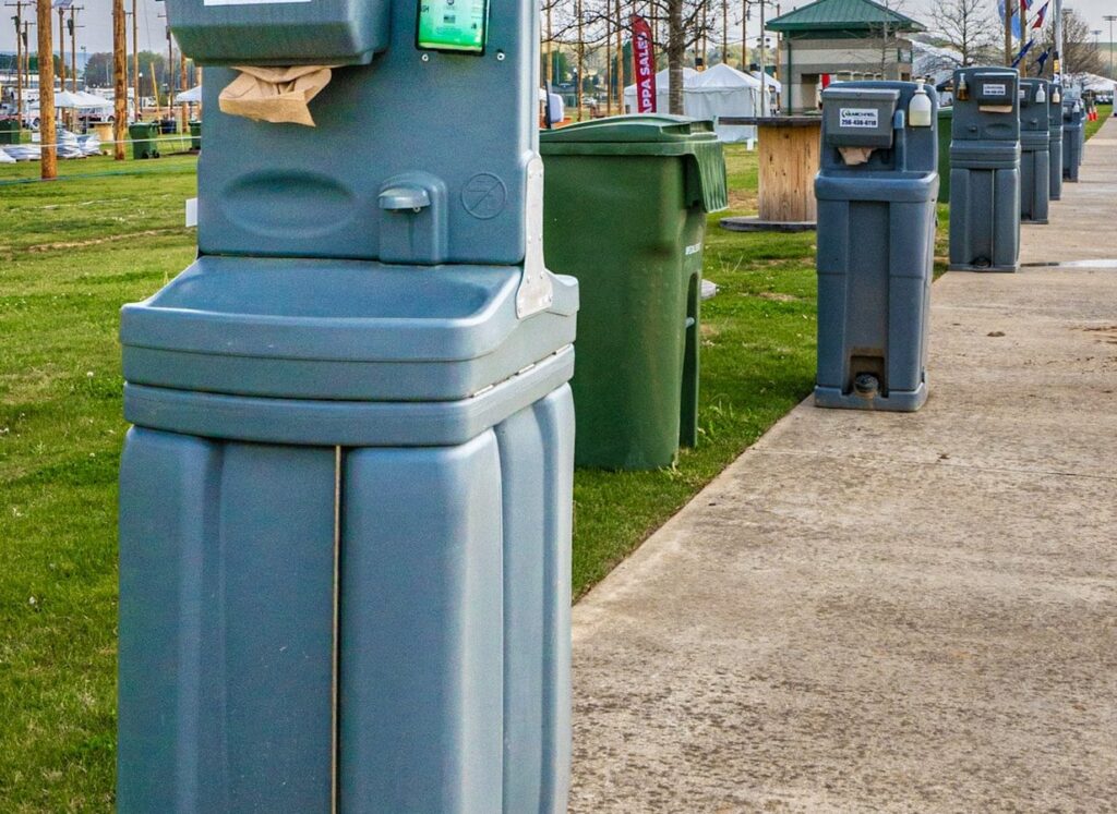 McMichael Waste Services hand-wash stations along a walkway in Huntsville, Alabama