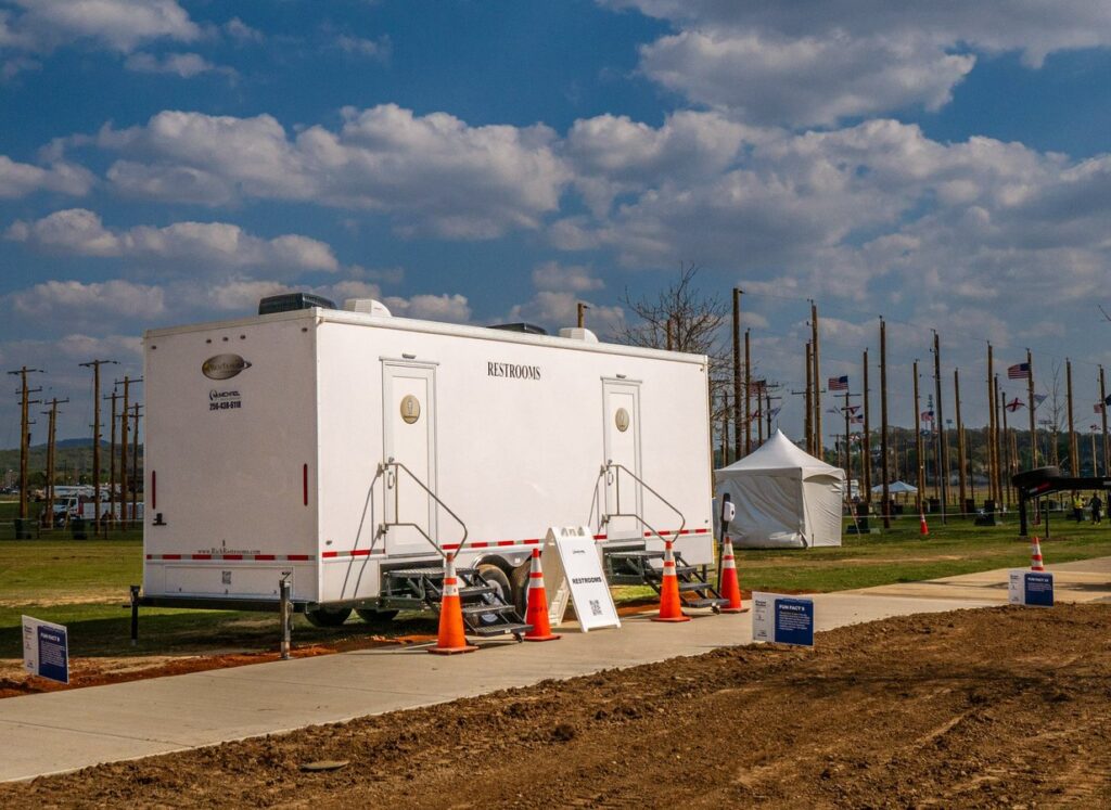 McMichael Waste Services restroom trailer set up at an outdoor event in Huntsville, Alabama