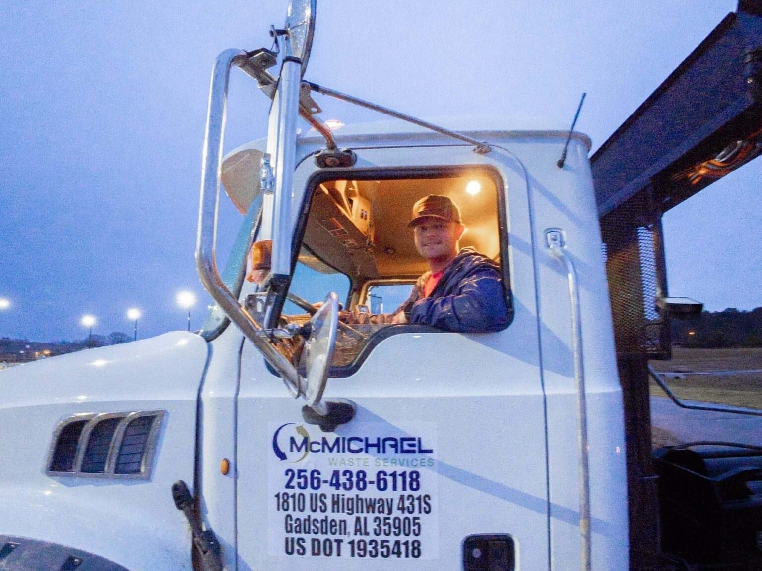 McMichael Waste Services roll-off driver in the truck cab in Alabama