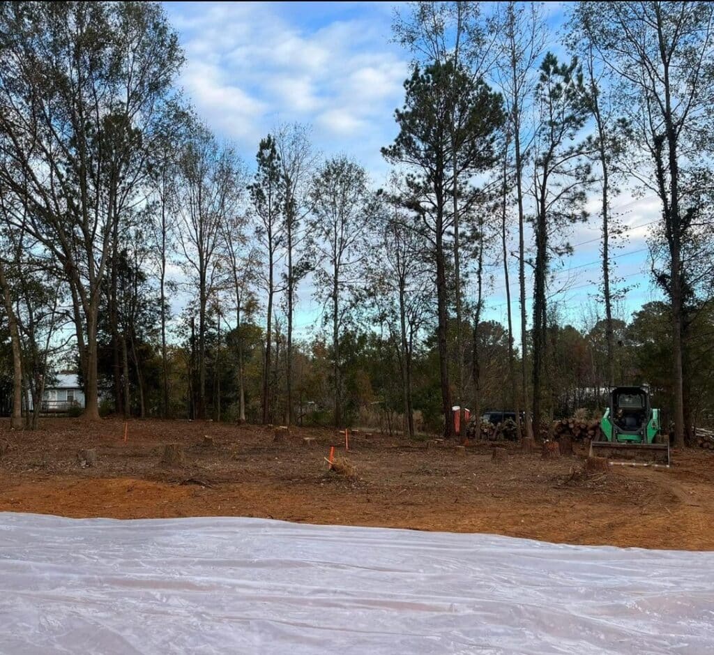 Cleared lot with skid steer during site prep by McMichael Waste Services in Alabama