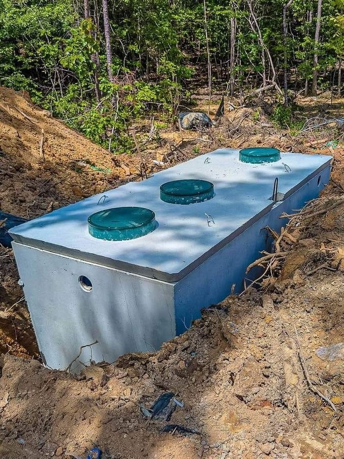 New concrete septic tank set in place during a septic tank installation in Alabama