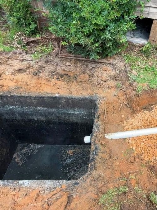 Failed septic tank being replaced and reconnected by McMichael Waste Services in Alabama